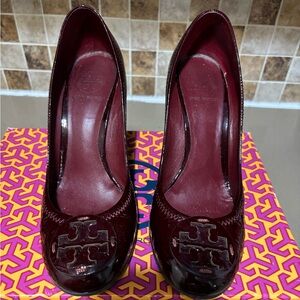 Cranberry patent leather Tory Burch wedges.